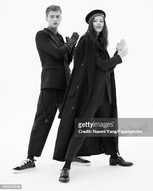 Models Alice Gilbert and Adrien Jacques pose at a fashion shoot for Madame Figaro on November 14, 2017 in Paris, France. Adrien: suit, pullover,...