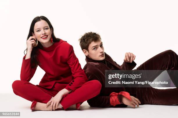 Models Alice Gilbert and Adrien Jacques pose at a fashion shoot for Madame Figaro on November 14, 2017 in Paris, France. Alice: suit by Escada....