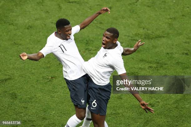 France's foward Ousmane Dembele celebrates with France's Paul Pogba after scoring a goal during the friendly football match between France and Italy...