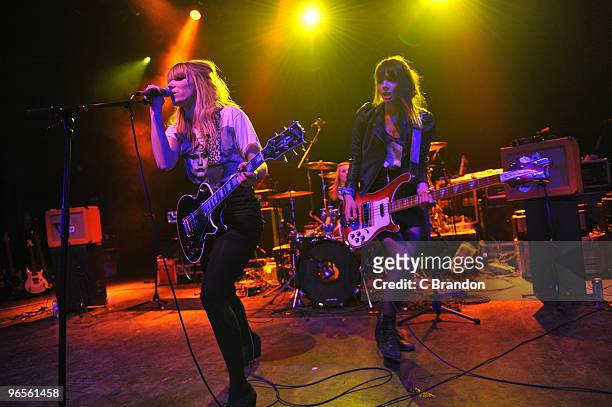 Katty Besnard and Louise Basilien of the Plastiscines perform on stage at Shepherds Bush Empire on February 10, 2010 in London, England.