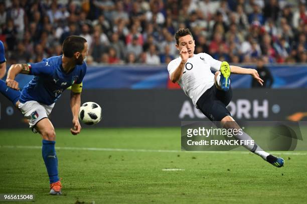 France's foward Florian Thauvin kicks the ball during the friendly football match between France and Italy at the Allianz Riviera Stadium in Nice,...