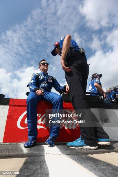 Alex Bowman, driver of the Nationwide Chevrolet, talks with crew chief, Greg Ives, during qualifying for the Monster Energy NASCAR Cup Series Pocono...