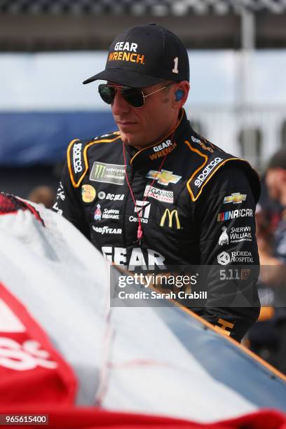 Jamie McMurray, driver of the GEARWRENCH Chevrolet, climbs into his car during qualifying for the Monster Energy NASCAR Cup Series Pocono 400 at...