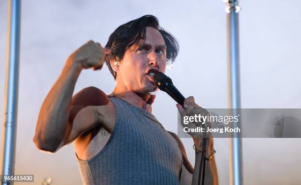 The Austrian band 'Bilderbuch' with singer Maurice Ernst perform at Rock im Park 2018 festival at Zeppelinfeld on June 1, 2018 in Nuremberg, Germany.