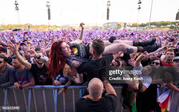Fans celebrate the performance of the US rock band 'Foo Fighters' at Rock im Park 2018 festival at Zeppelinfeld on June 1, 2018 in Nuremberg, Germany.
