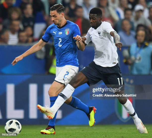 Mattia De Sciglio of Italy competes for the ball whit Ousmane Dembèlè of France during the International Friendly match between France and Italy at...