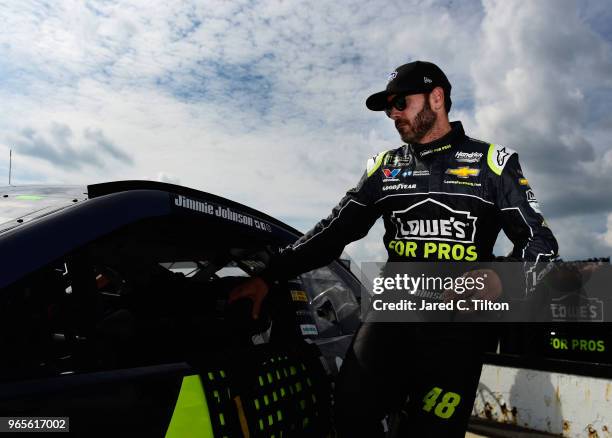 Jimmie Johnson, driver of the Lowe's for Pros Chevrolet, climbs into his car during qualifying for the Monster Energy NASCAR Cup Series Pocono 400 at...