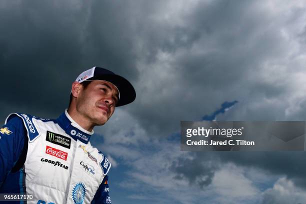 Kyle Larson, driver of the DC Solar Chevrolet, stands on the grid during qualifying for the Monster Energy NASCAR Cup Series Pocono 400 at Pocono...