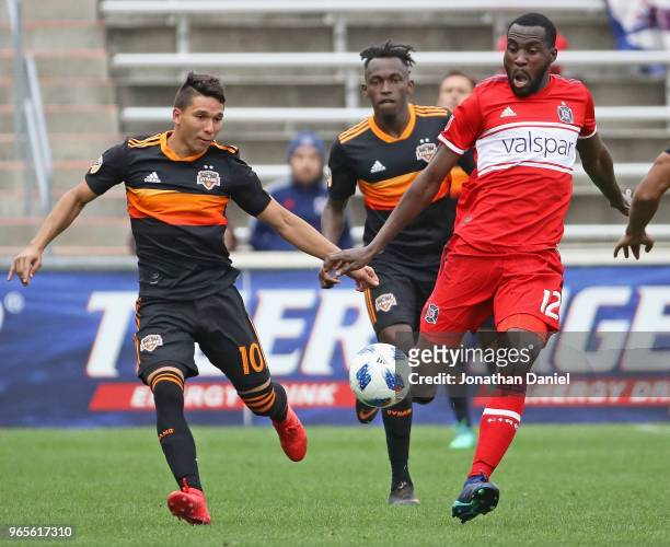 Tony Tchani of the Chicago Fire and Tomas Martinez of the Houston Dynamo chase down the ball at Toyota Park on May 20, 2018 in Bridgeview, Illinois....