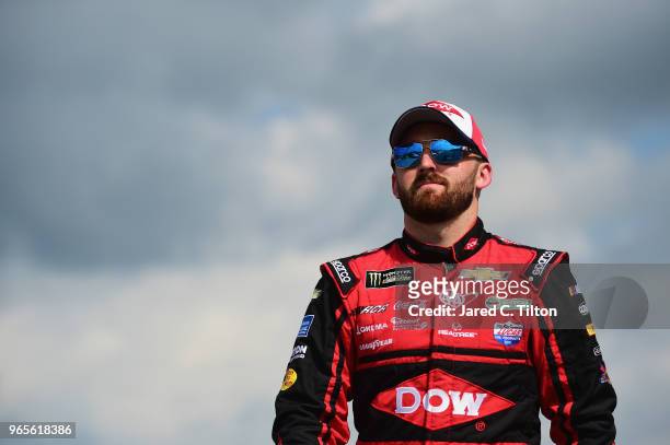 Austin Dillon, driver of the Dow Chevrolet, walks on the grid during qualifying for the Monster Energy NASCAR Cup Series Pocono 400 at Pocono Raceway...