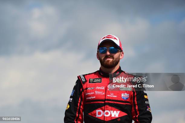 Austin Dillon, driver of the Dow Chevrolet, walks on the grid during qualifying for the Monster Energy NASCAR Cup Series Pocono 400 at Pocono Raceway...