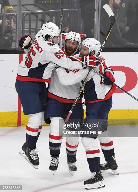Brooks Orpik of the Washington Capitals is congratulated by teammates Andre Burakovsky and Brett Connolly after scoring a second-period goal against...