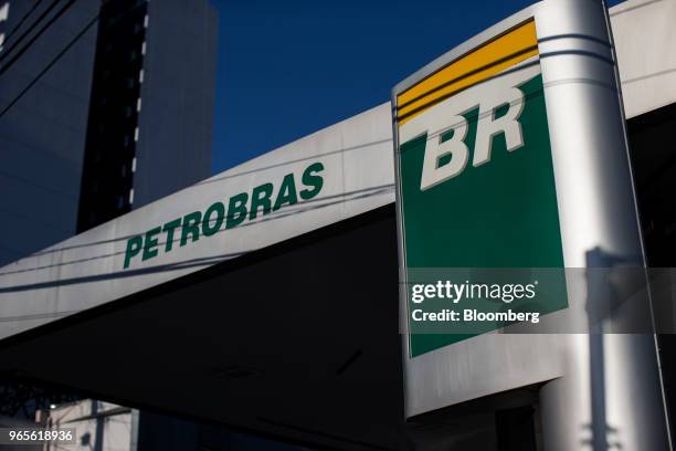 Signage is displayed at a Petroleos Brasileiros SA gas station in Sao Paulo, Brazil, on Friday, June 1, 2018. Pedro Parente resigned as chief...