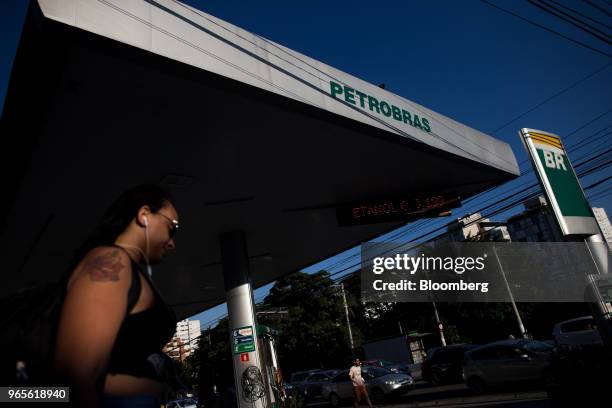 Pedestrian walks past a Petroleos Brasileiros SA gas station in Sao Paulo, Brazil, on Friday, June 1, 2018. Pedro Parente resigned as chief executive...