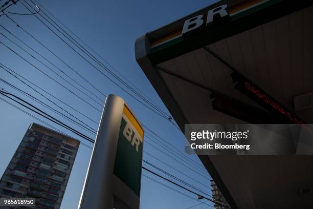 Signage is displayed at a Petroleos Brasileiros SA gas station in Sao Paulo, Brazil, on Friday, June 1, 2018. Pedro Parente resigned as chief...