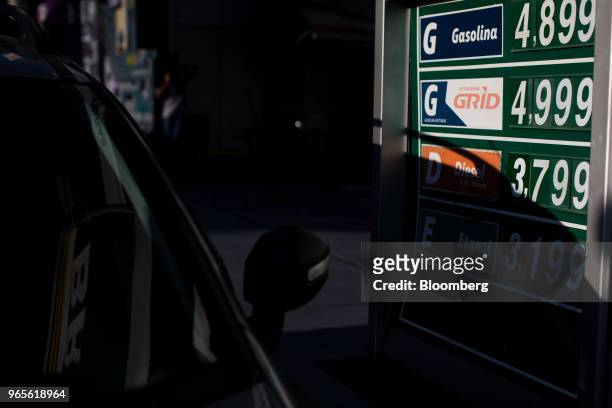 Fuel prices are displayed at a Petroleos Brasileiros SA gas station in Sao Paulo, Brazil, on Friday, June 1, 2018. Pedro Parente resigned as chief...