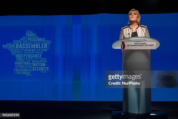 Head of the French far-right party Front national Marine Le Pen speaks as the party members backed the changing of the National Front name for...