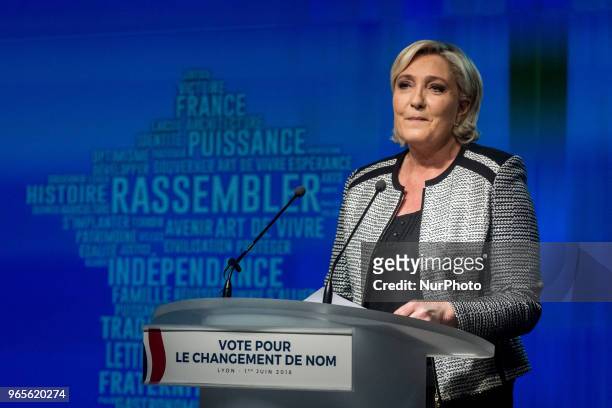 Head of the French far-right party Front national Marine Le Pen speaks as the party members backed the changing of the National Front name for...