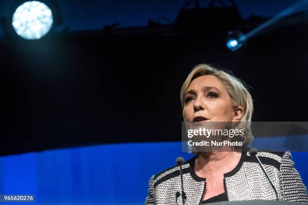 Head of the French far-right party Front national Marine Le Pen speaks as the party members backed the changing of the National Front name for...