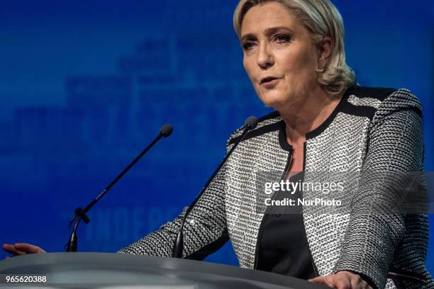 Head of the French far-right party Front national Marine Le Pen speaks as the party members backed the changing of the National Front name for...