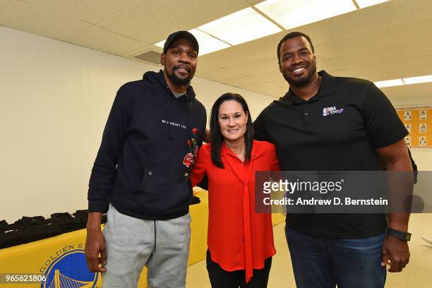 Kevin Durant of the Golden State Warriors, Jennifer Azzi and Jason Collins pose for a photo during the 2018 NBA Finals Legacy Project - NBA Cares on...