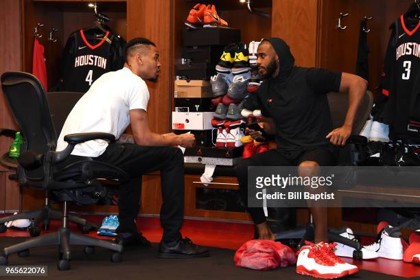Gerald Green and Chris Paul of the Houston Rockets talk in the locker room before the game against the Golden State Warriors in Game Seven of the...