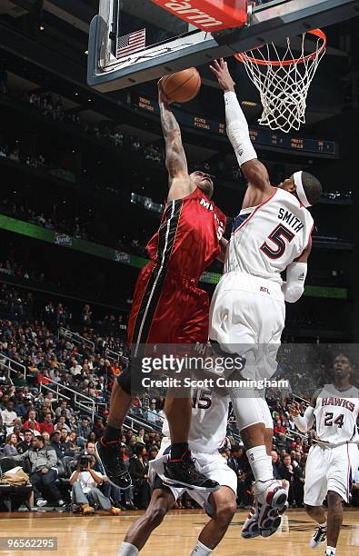 Josh Smith of the Atlanta Hawks blocks a dunk attempt by Quentin Richardson of the Miami Heat on February 10, 2010 at Philips Arena in Atlanta,...