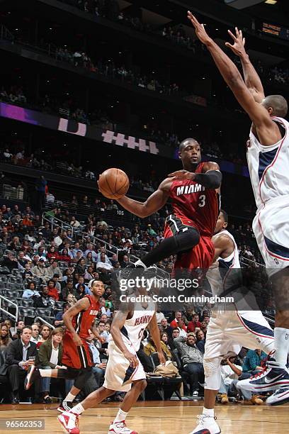 Dwyane Wade of the Miami Heat looks to pass against the Atlanta Hawks on February 10, 2010 at Philips Arena in Atlanta, Georgia. NOTE TO USER: User...