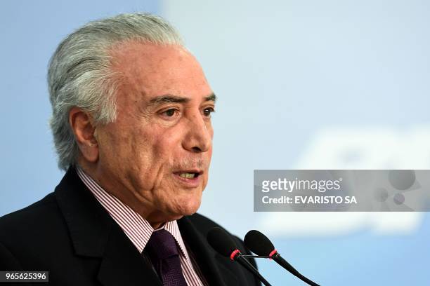 President Michel Temer makes a statement at Planalto Palace to announce Ivan Monteiro as Petrobras' new president, in Brasilia on June 1, 2018. -...