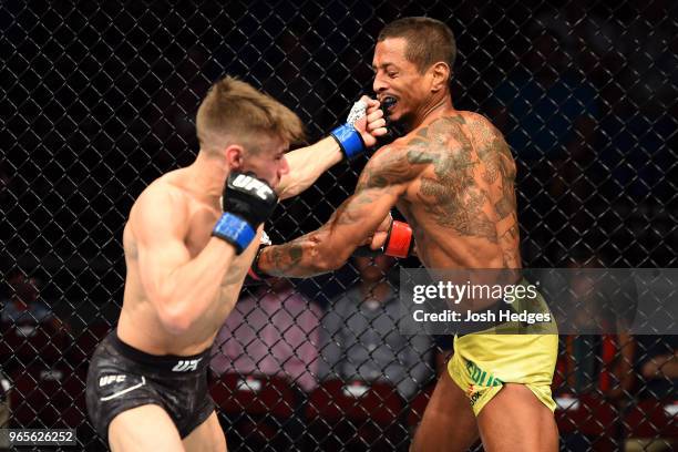 Nathaniel Wood of England punches Johnny Eduardo of Brazil in their bantamweight fight during the UFC Fight Night event at the Adirondack Bank Center...