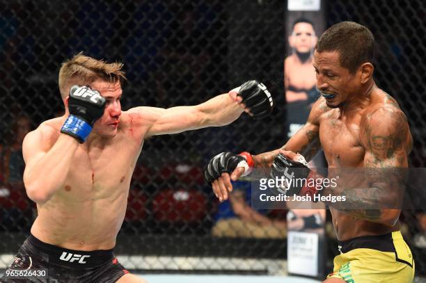 Nathaniel Wood of England punches Johnny Eduardo of Brazil in their bantamweight fight during the UFC Fight Night event at the Adirondack Bank Center...