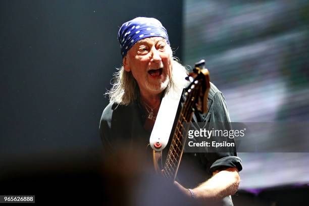 Bass guitarist Roger Glover of the British rock band Deep Purple performs during a concert as part of their 'The Long Goodbye Tour' at Olympiysky...