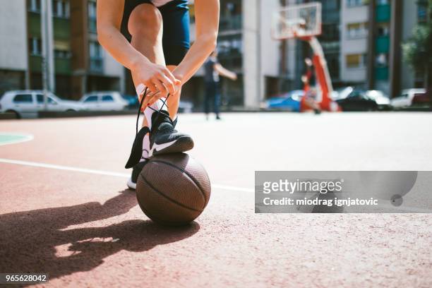 preparing for a game - basketball shoe stock pictures, royalty-free photos & images