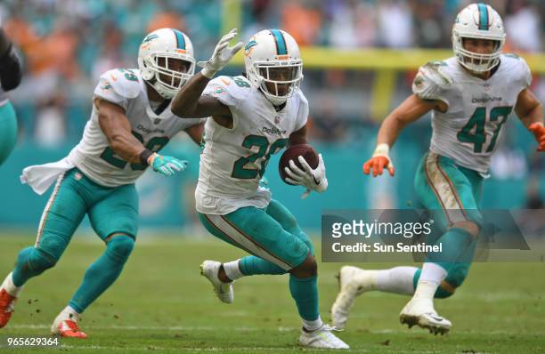 Miami Dolphins cornerback Bobby McCain intercepts a pass late in the fourth quarter against the New York Jets on October 22 at Hard Rock Stadium in...