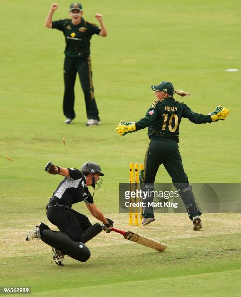 Maria Fahey of New Zealand is run out by Rachael Haynes of Australia as wicketkeeper Alyssa Healy looks on during the Second Women's One Day...
