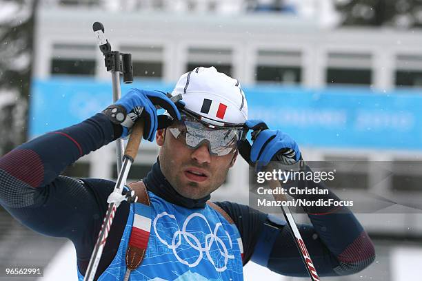 Simon Fourcade of France controlls his glasses during the men's Biathlon Training at the Olympic Winter Games Vancouver 2010 on February 10, 2010 in...