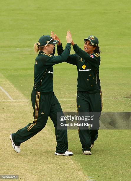 Lisa Sthalekar of Australia celebrates with Alex Blackwell after taking the wicket of Victoria Lind of New Zealand during the Second Women's One Day...