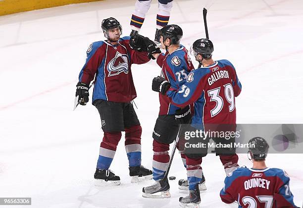 Brett Clark, Chris Stewart and T.J. Galiardi of the Colorado Avalanche celebrate a goal against the Atlanta Thrashers at the Pepsi Center on February...