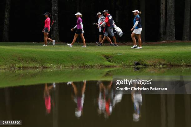 Jin Young Ko of South Korea, Stacy Lewis and Ariya Jutanugarn of Thailand walk up to the fifth green during the second round of the 2018 U.S. Women's...