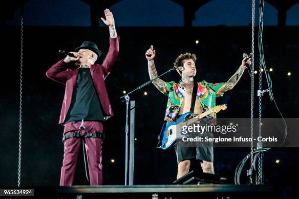 Ax and Fedez perform on stage at Stadio San Siro on June 1, 2018 in Milan, Italy.