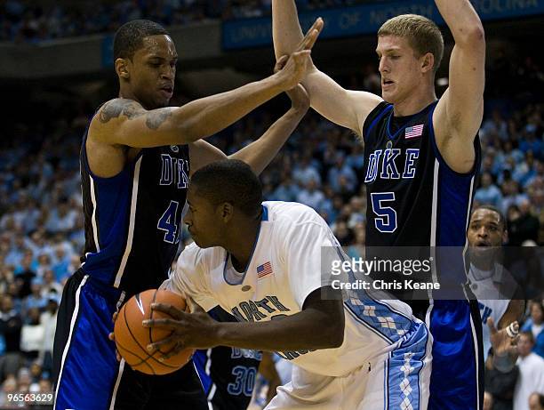 North Carolina forward Ed Davis looks to pass around Duke forward Lance Thomas and Duke forward Mason Plumlee during a men's college basketball game...