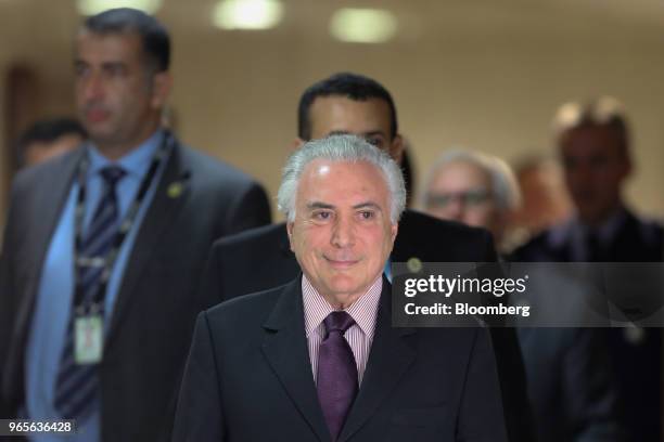 Michel Temer, Brazil's president, arrives to a press conference on the resignation of Petroleos Brasileiros SA chief executive officer in Brasilia,...