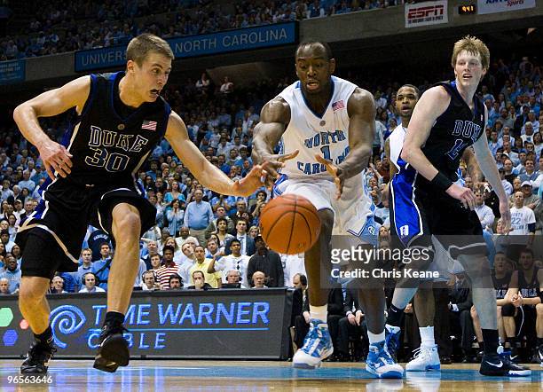 North Carolina guard/forward Marcus Ginyard battles Duke guard Jon Scheyer for a loose ball during a men's college basketball game at Dean Smith...