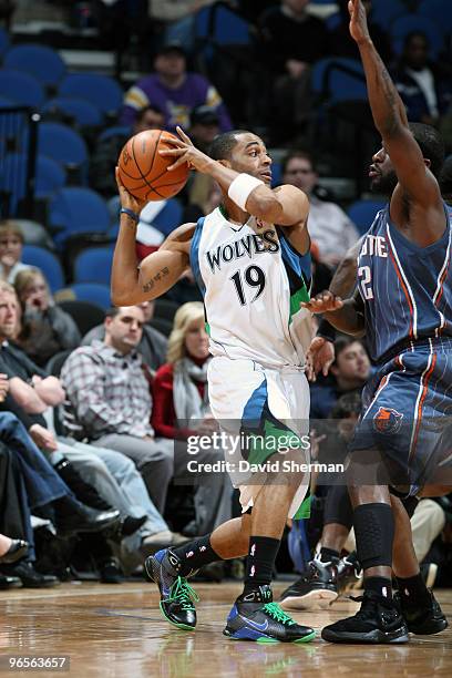 Wayne Ellington of the Minnesota Timberwolves looks to pass the ball against Flip Murray of the Charlotte Bobcats during the game on February 10,...