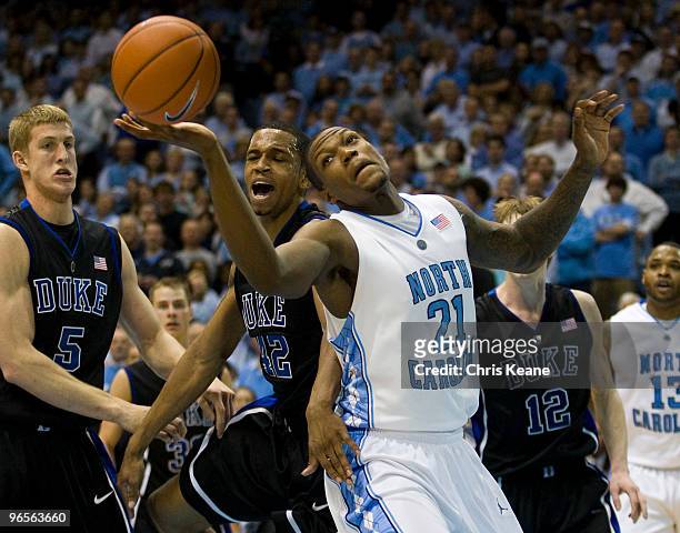 North Carolina forward Deon Thompson fights for a rebound against Duke forward Lance Thomas during a men's college basketball game at Dean Smith...