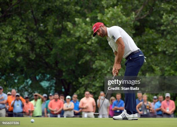 Dustin Johnson hits a putt on the second hole during the second round of the Memorial Tournament presented by Nationwide at Muirfield Village Golf...