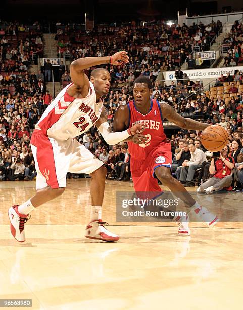 Royal Ivey of the Philadelphia 76ers drives against Sonny Weems of the Toronto Raptors during a game on February 10, 2010 at the Air Canada Centre in...