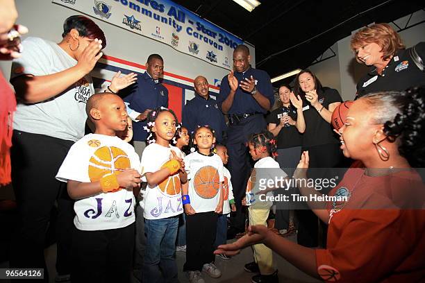 Former NBA player Dikembe Mutombo, WFormer NBA player Jennifer Azzi and kids cheer during the NBA Cares Community Caravan at the Vogel Alcove...