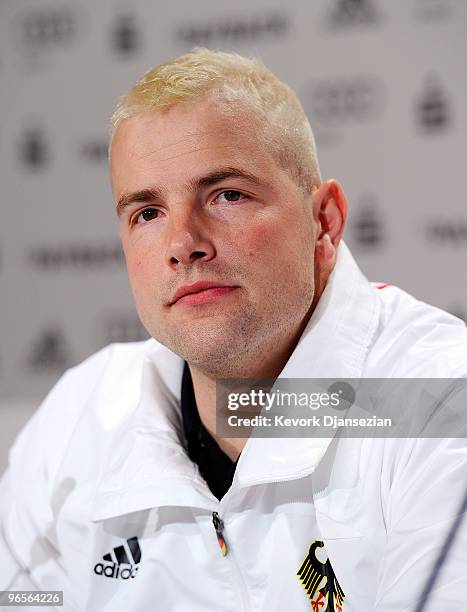 André Lange reacts after a news conference to announce his the flag bearer of the German Olympic team ahead of the Vancouver 2010 Winter Olympics on...