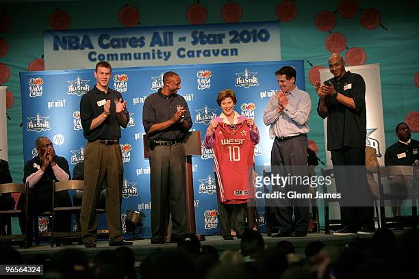 Matt Carroll, Jason Terry of the Dallas Mavericks, Former first lady Laura Bush, Owner Mark Cuban and James Singleton of the Dallas Mavericks during...